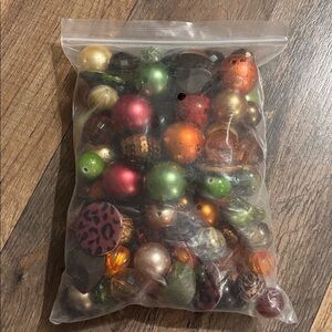 Assorted bag of brown green gold bubblegum beads for crafting or jewelry making